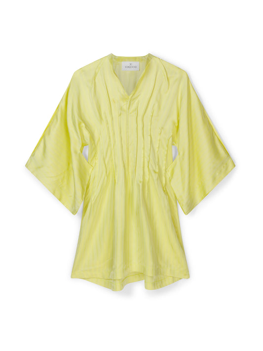 Yellow tunic dress by COLUCCI, crafted from luxurious discontinued deadstock fabrics for a one-of-a-kind, limited edition piece. Made-to-order in our London studio with kimono-inspired sleeves and a pin-tuck waist, this dress offers timeless style and impeccable design, destined to be a cherished wardrobe staple.
