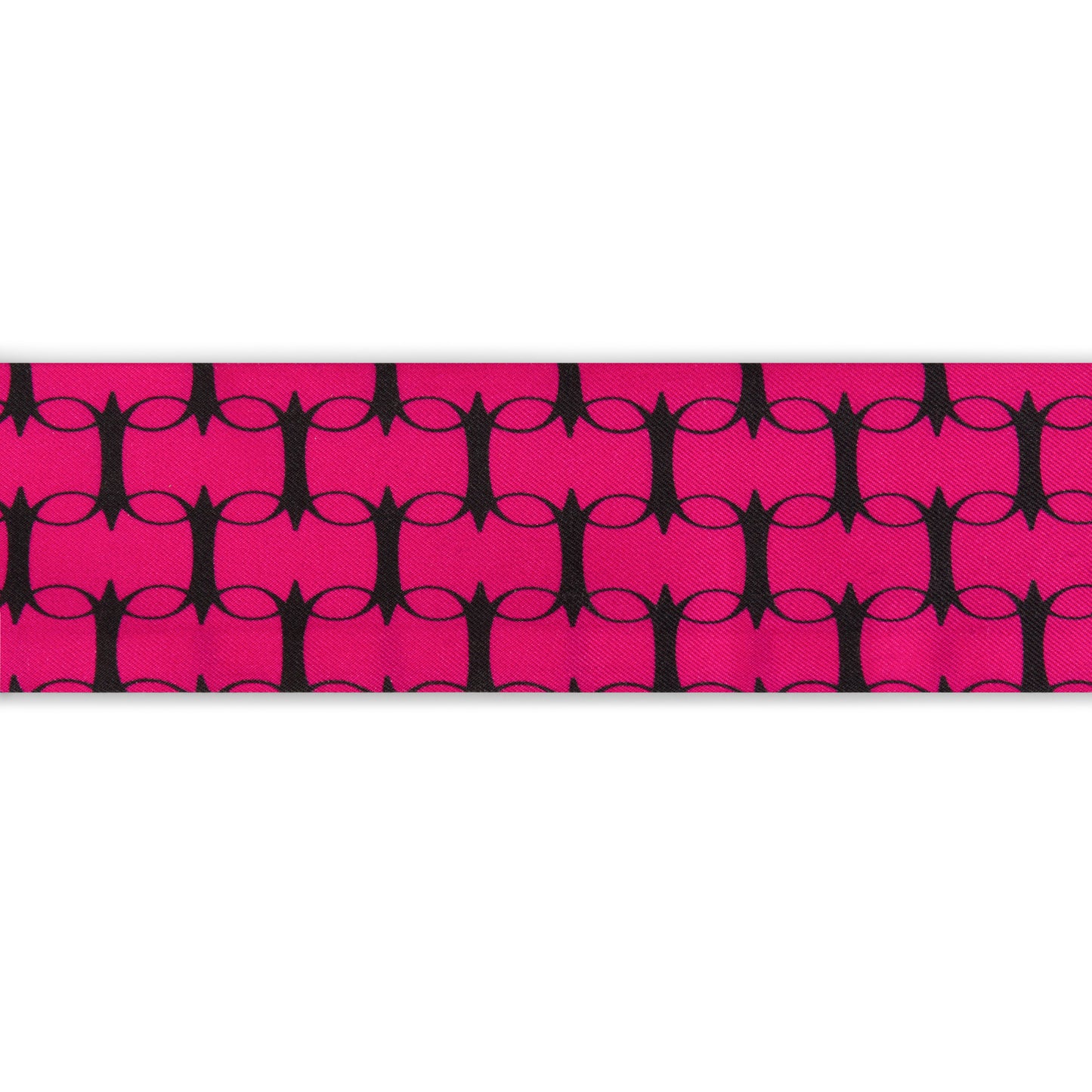 Pink and orange monogram silk twilly by COLUCCI, meticulously printed in Macclesfield. This limited-edition scarf offers unique luxury and reflects a commitment to sustainable fashion, perfect for elegantly tying around your neck or adding sophistication to your bag.