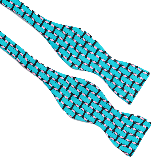 Teal and pink silk bow tie by COLUCCI, handcrafted in England. Featuring a playful colour combination, this bow tie adds vibrant flair and refined elegance to any formal or special occasion ensemble, making it the perfect finishing touch for a standout look.