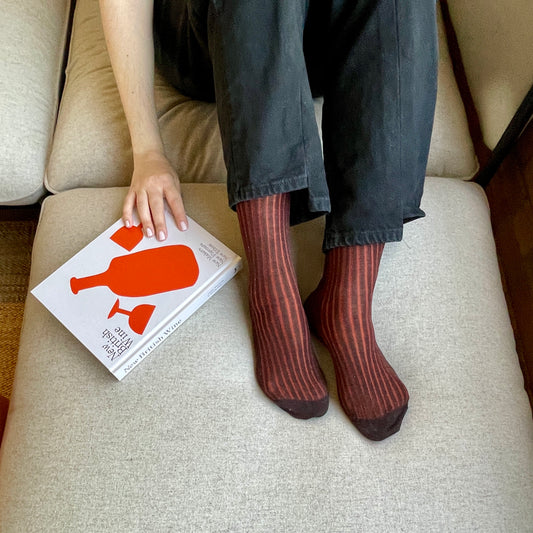 Italian-made brown mid-calf socks with orange shadow rib detail, crafted from 100% pure cotton for superior comfort and refined style.