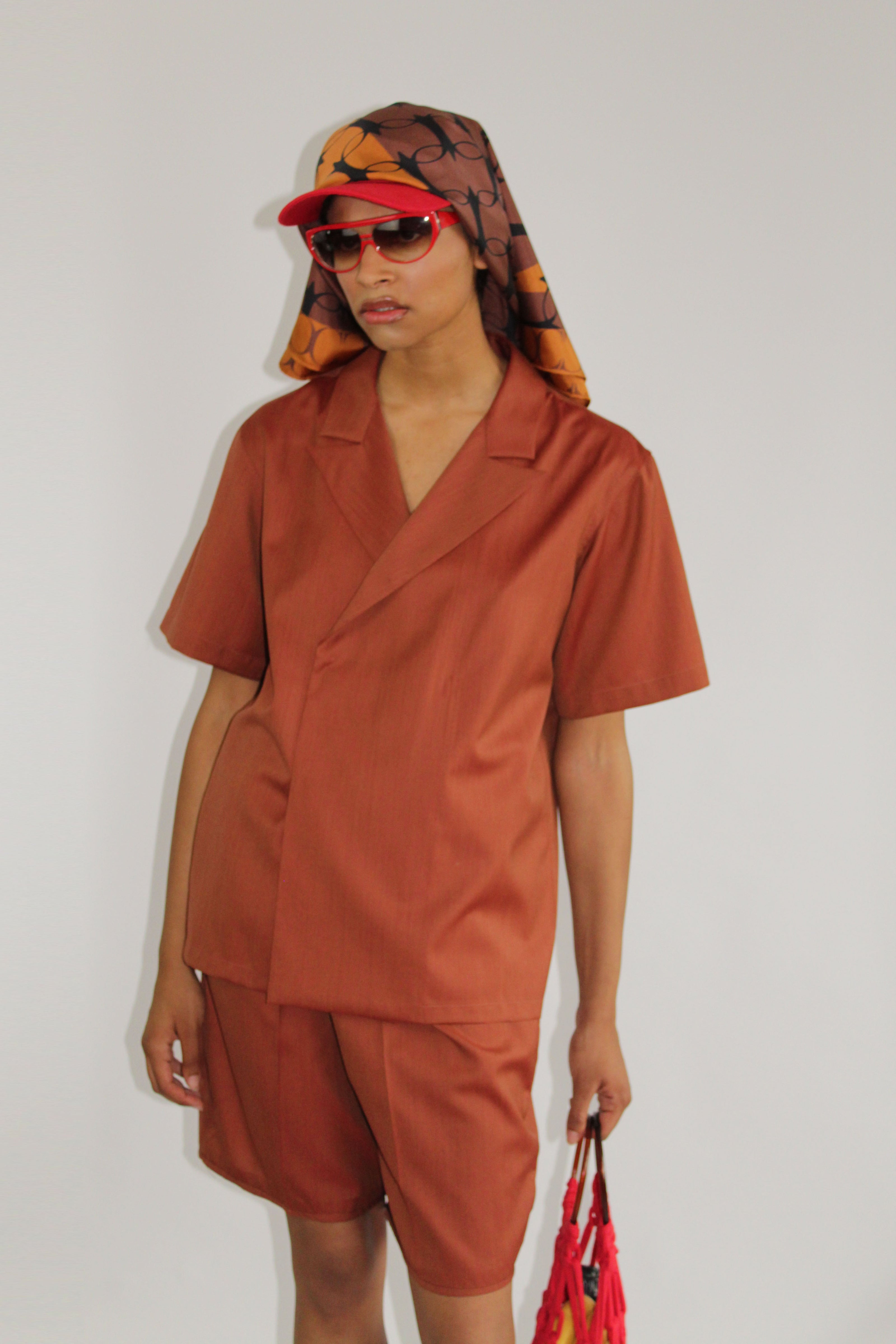 Elevate your style with our exclusive brown mohair double-breasted bowling shirt, a blend of traditional tailoring and modern luxury. Crafted from premium wool mohair on Savile Row, this limited edition shirt exudes sophistication with its double-breasted design and rich brown hue. Meticulous craftsmanship, concealed snaps, and a precise fit ensure an air of elegant refinement. Discover contemporary luxury with this timeless masterpiece, seamlessly blending vintage inspiration and modern craftsmanship.